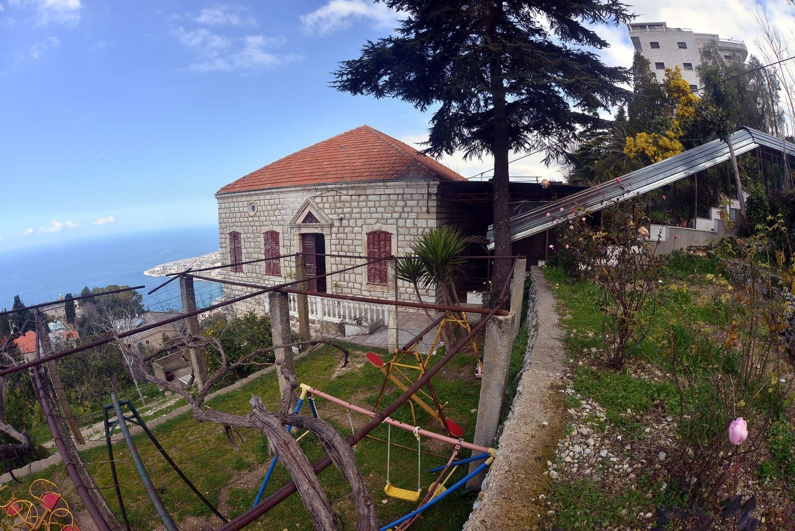The Home’s terraced garden with its swings, below the house.